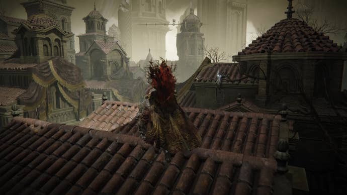A warrior clambers over rooftops to reach a corpse in Belurat, Tower Settlement in Shadow of the Erdtree.