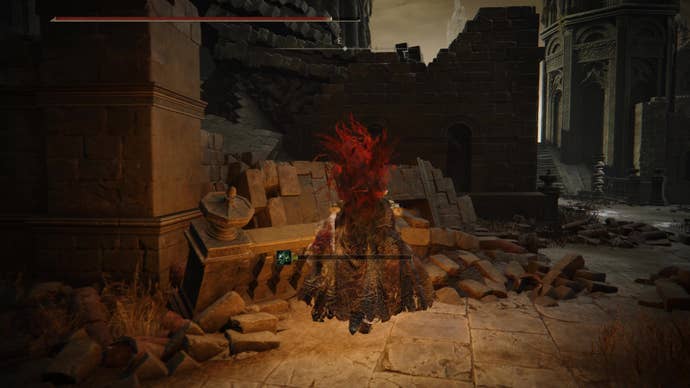 A warrior runs up a crumbled wall in Belurat, Tower Settlement in Shadow of the Erdtree.