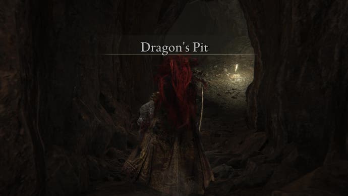 A warrior enters a dark cave called Dragon's Pit in Shadow of the Erdtree.