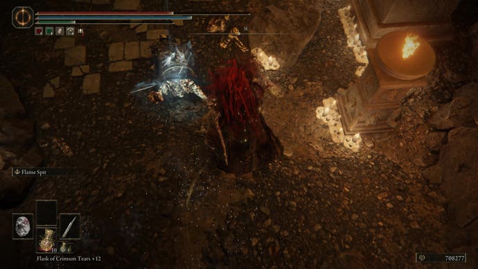 A warrior attacks a glowing corpse of a skeleton monster in the Dragon's Pit in Shadow of the Erdtree
