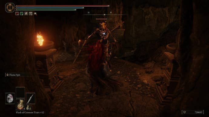 A warrior fights a monster skeleton creature in the Dragon’s Pit in Shadow of the Erdtree