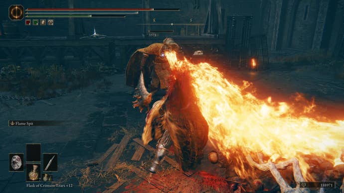 A warrior fights a fire-breathing knight in the Fort of Reprimand in Shadow of the Erdtree.