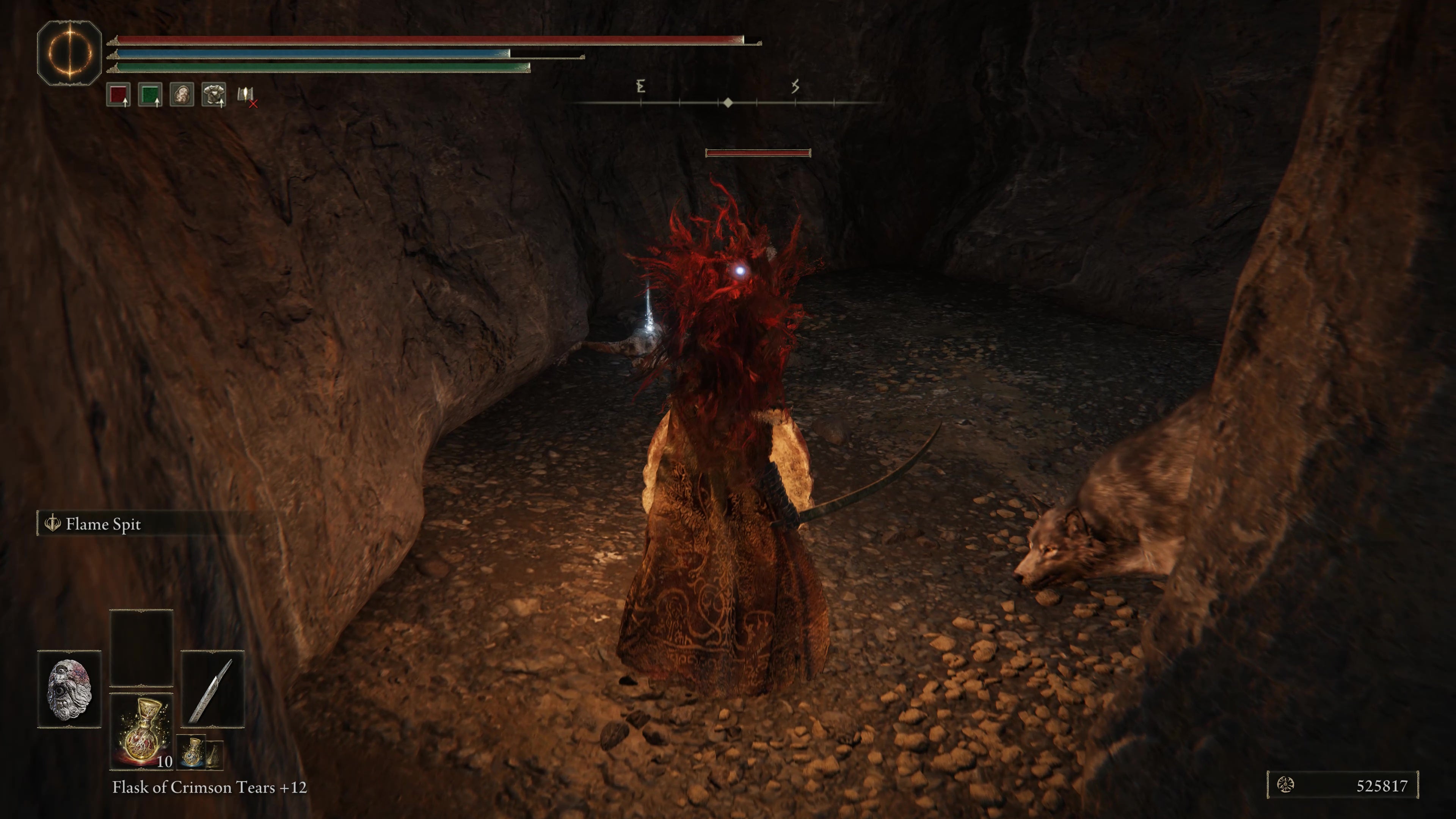 A warrior fights two wolves inside the Rivermouth Cave in Shadow of the Erdtree.