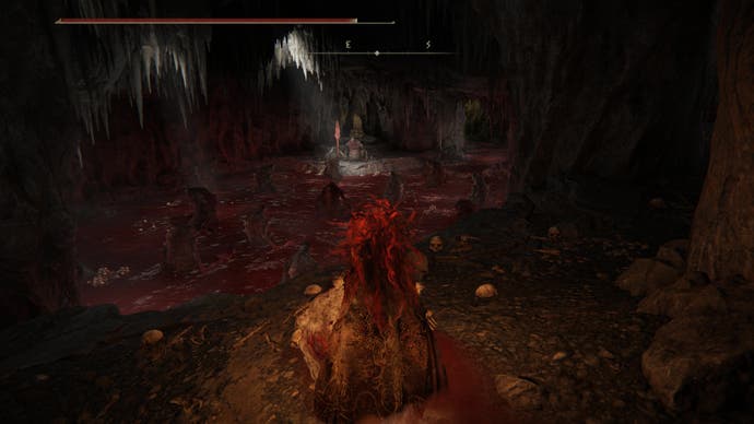 A warrior looks on a strange scene inside  the Rivermouth Cave in Shadow of the Erdtree, where trolls worship a stone altar on a pool of blood.