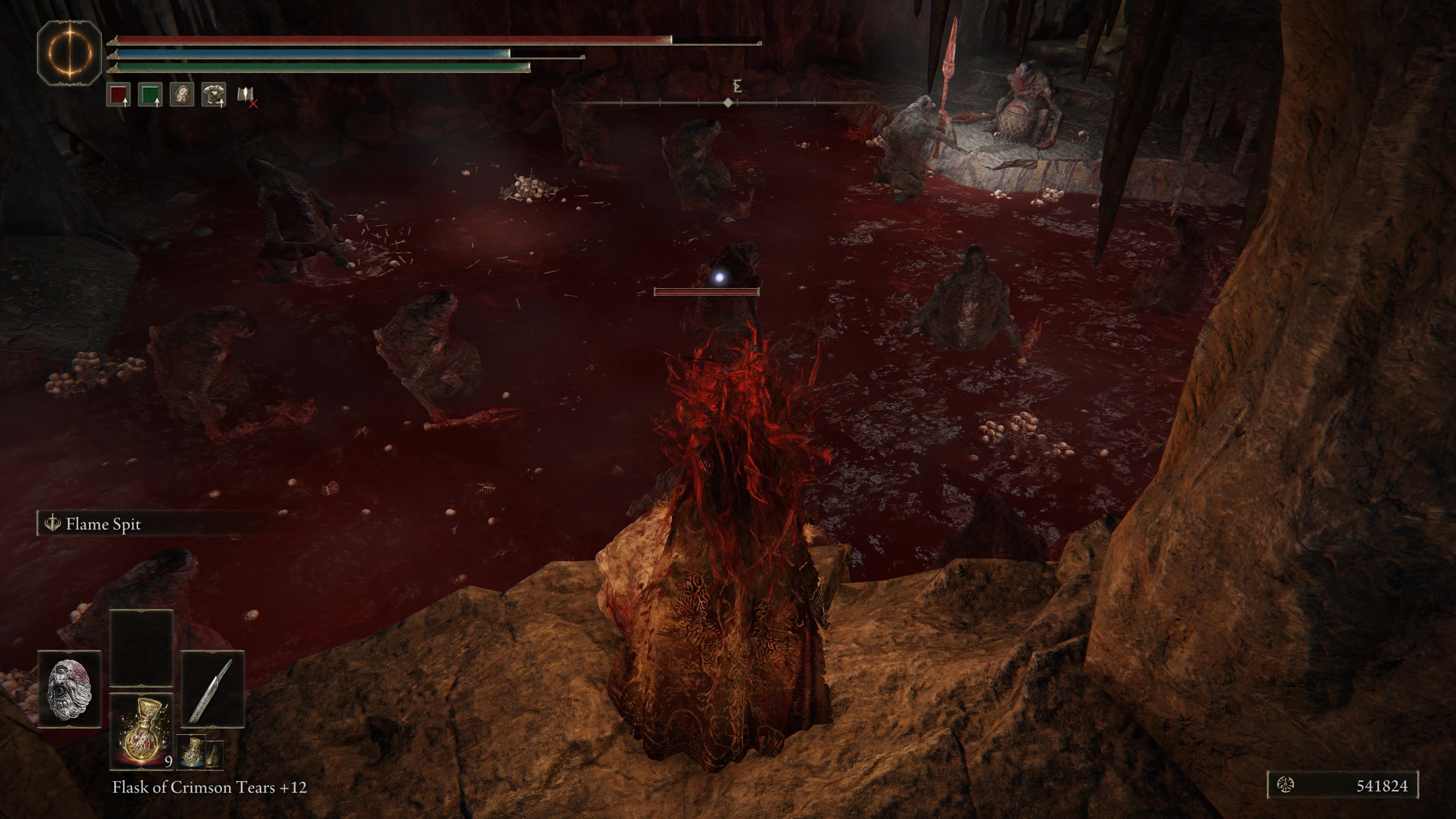 A warrior looks down to attack several trolls in a pool of blood in  the Rivermouth Cave in Shadow of the Erdtree.