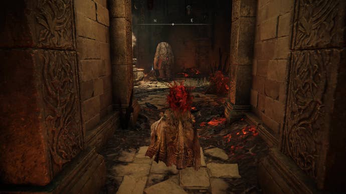 A warrior enters the Ruined Forge Lava Intake dungeon in Shadow of the Erdtree.