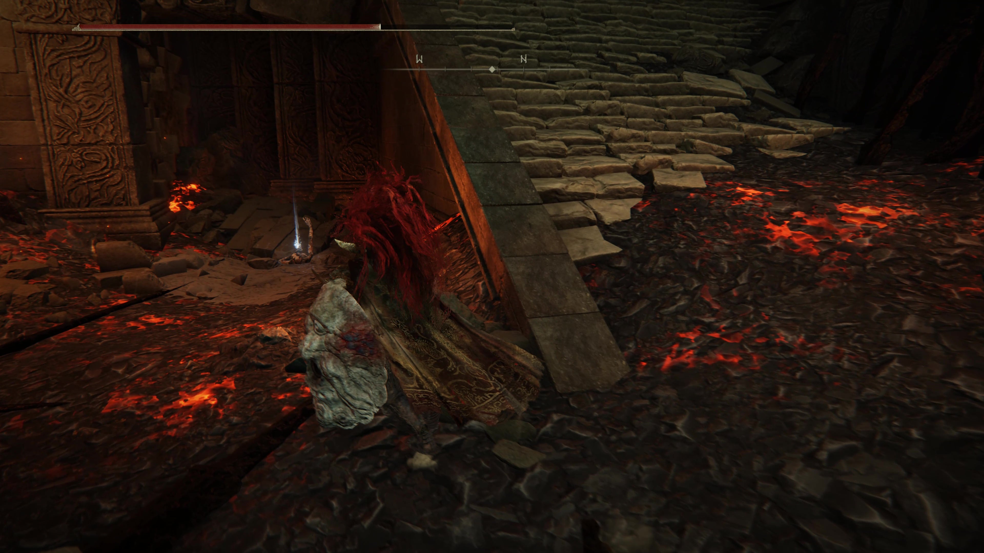 A warrior runs toward a shining corpse in the Ruined Forge Lava Intake dungeon in Shadow of the Erdtree.