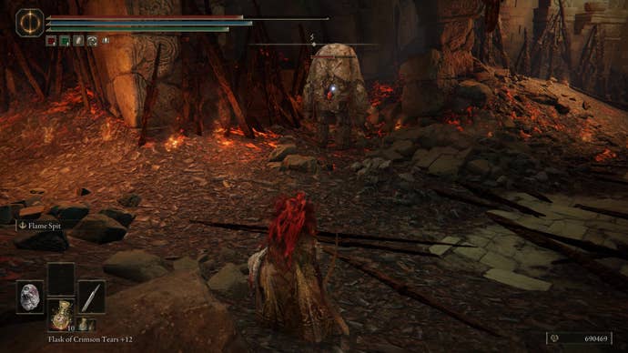 A warrior approaches a stone golem in the Ruined Forge Lava Intake dungeon in Shadow of the Erdtree.