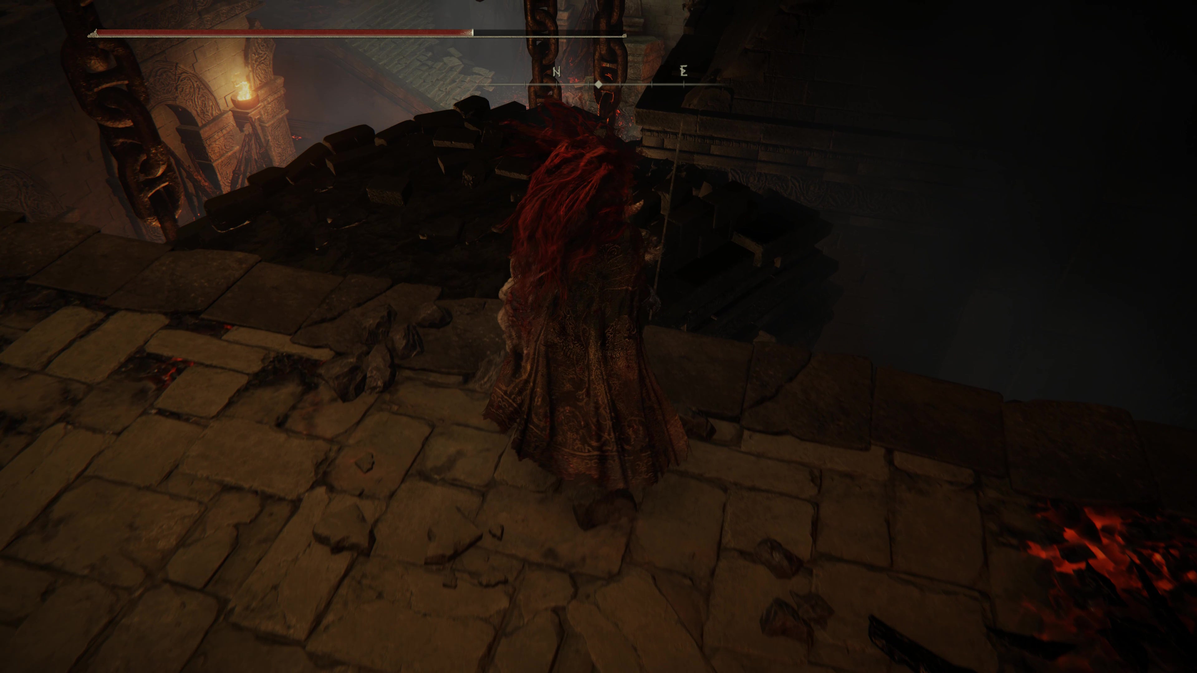 A warrior prepares to jump onto a rocky platform inside the Ruined Forge Lava Intake dungeon in Shadow of the Erdtree.