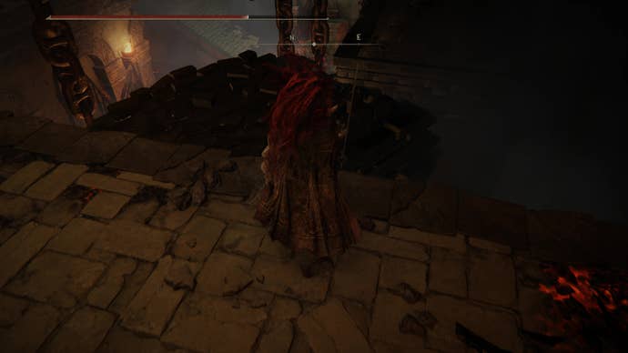 A warrior prepares to jump onto a rocky platform inside the Ruined Forge Lava Intake dungeon in Shadow of the Erdtree.