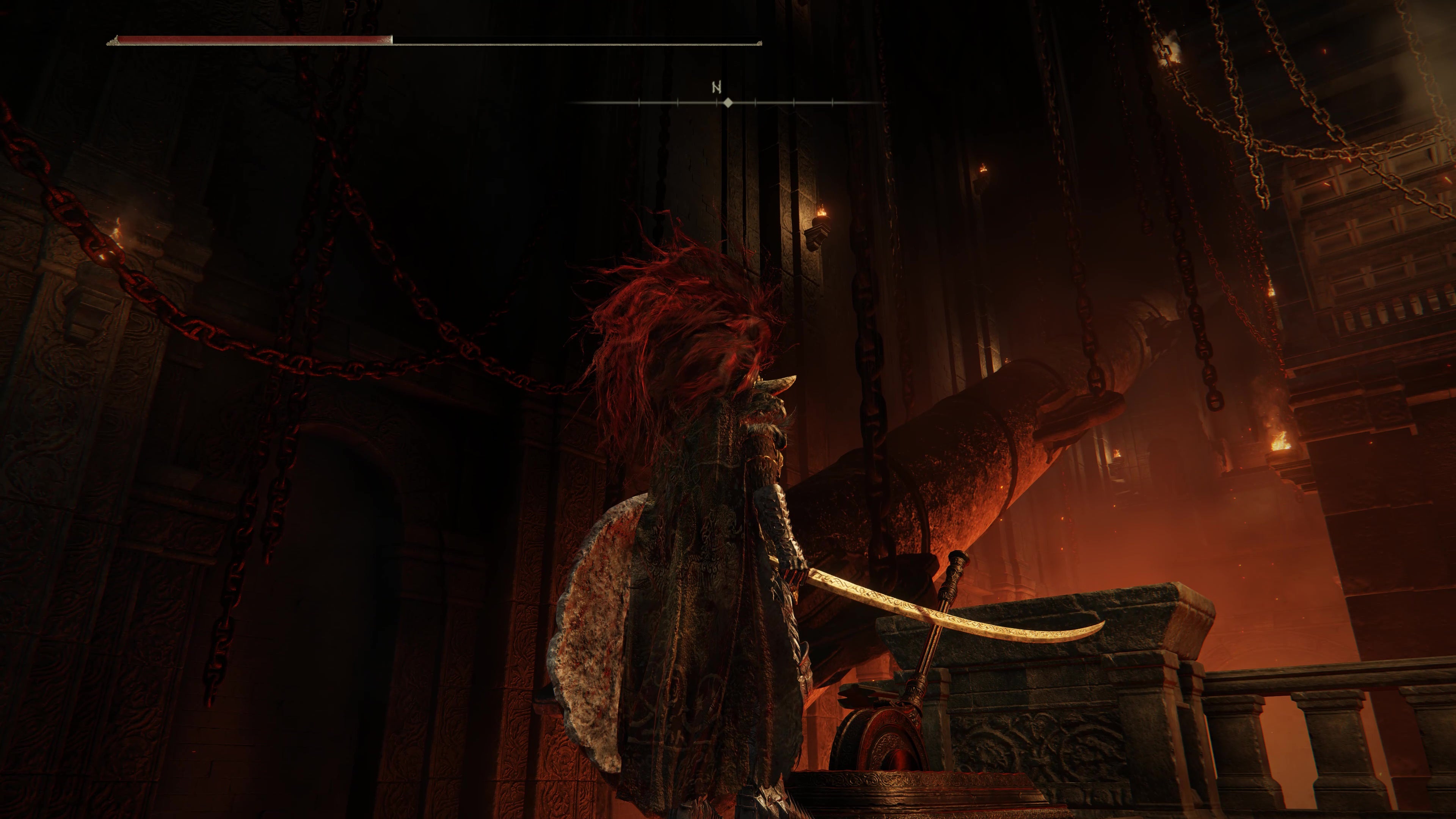 A warrior watches a large drill descend from the ceiling in the Ruined Forge Lava Intake dungeon in Shadow of the Erdtree.