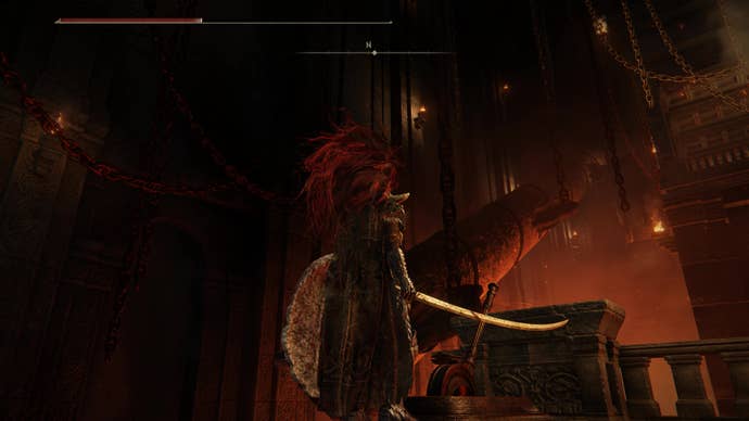 A warrior watches a large drill descend from the ceiling in the Ruined Forge Lava Intake dungeon in Shadow of the Erdtree.