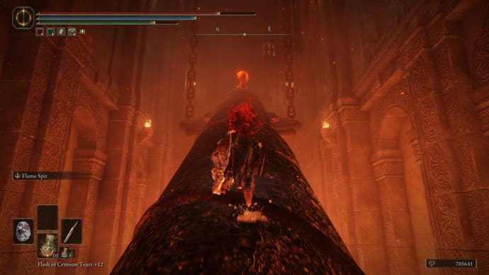 A warrior runs up a large metal drill in the Ruined Forge Lava Intake dungeon in Shadow of the Erdtree.