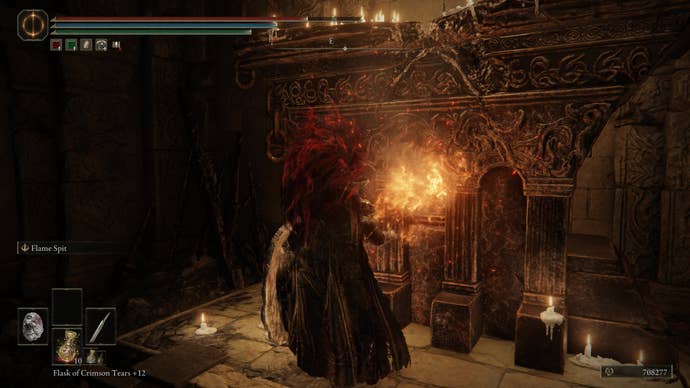 A warrior touches a fiery altar in the Ruined Forge Lava Intake dungeon in Shadow of the Erdtree.