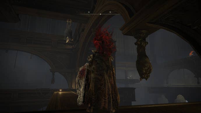 A warrior stands next to a bat gargoyle while looking at an actual giant bat on the way to the Shadow Keep’s Back Gate in Elden Ring Shadow of the Erdtree.