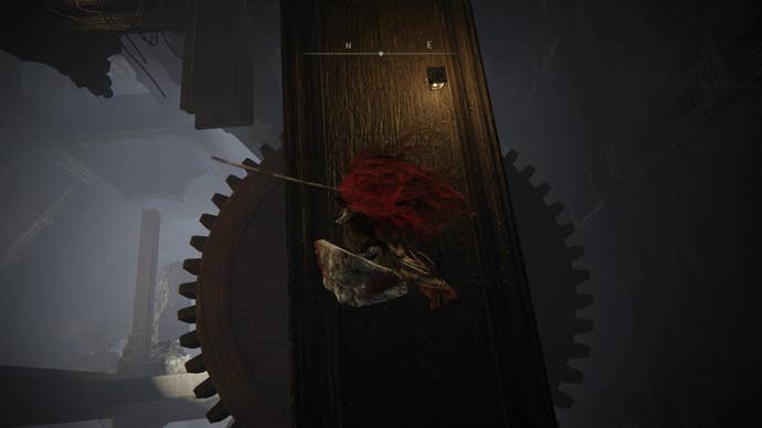 A warrior drops down onto a large cog in the Storehouse tower on the way to the Shadow Keep’s Back Gate in Elden Ring Shadow of the Erdtree.