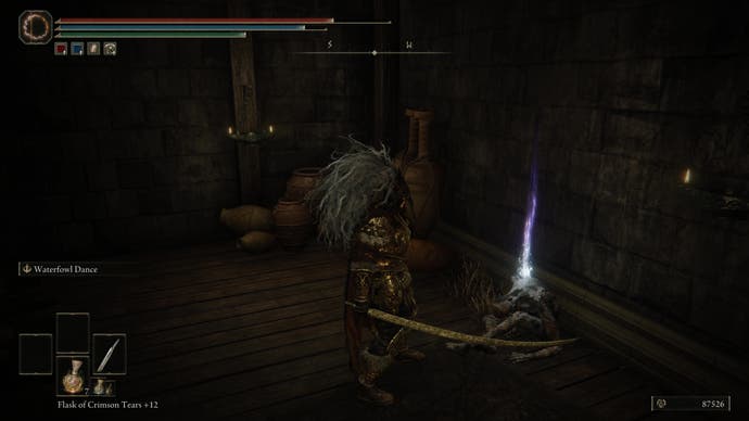 A warrior climbs a staircase to find the Storeroom Key item on a corpse in Belurat Tower Settlement in Elden Ring Shadow of the Erdtree.