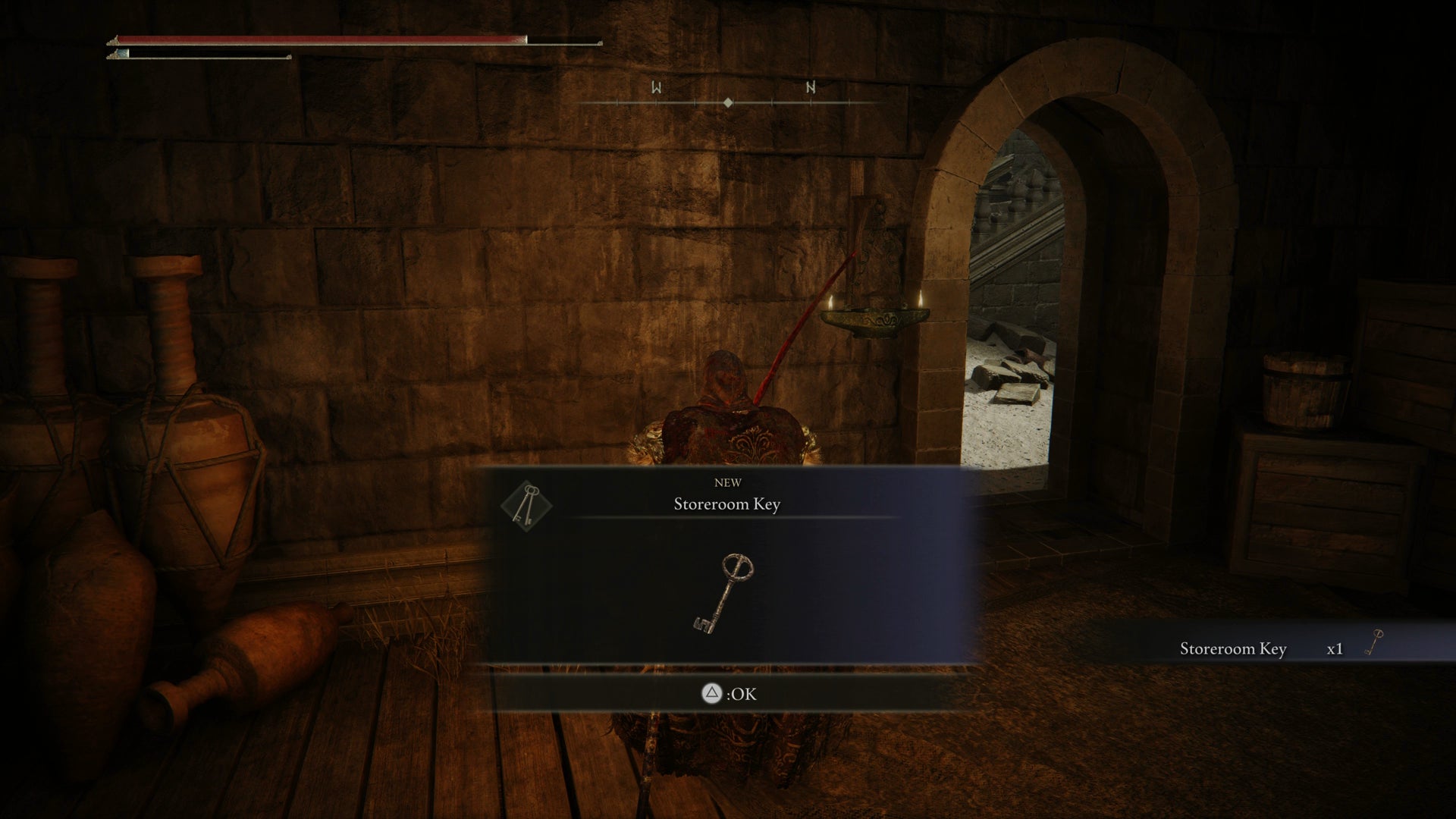 The Tarnished collecting the Storeroom key in Elden Ring Shadow of the Erdtree. - 1