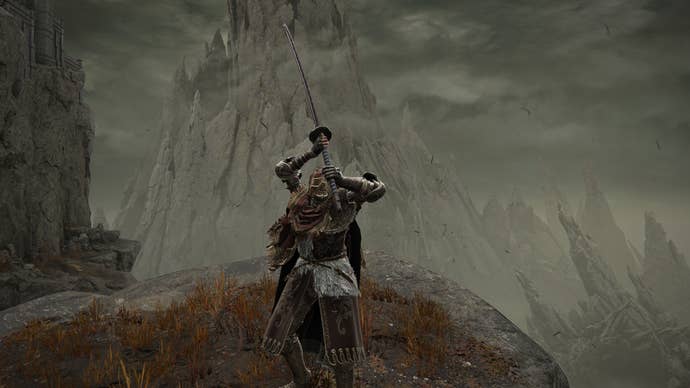 Elden Ring: Shadow Of The Erdtree screenshot of the Tarnished wielding the Great Katana and charging it’s Weapon Skill on a clifftop.