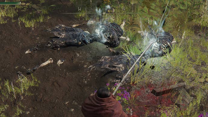 The player in Elden Ring looks at the ground where two dead skeletons are beginning to respawn.