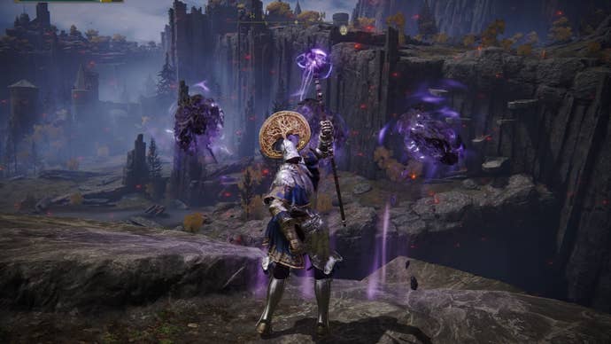 Elden Ring screenshot of the Tarnished performing the Rock Sling Sorcery.