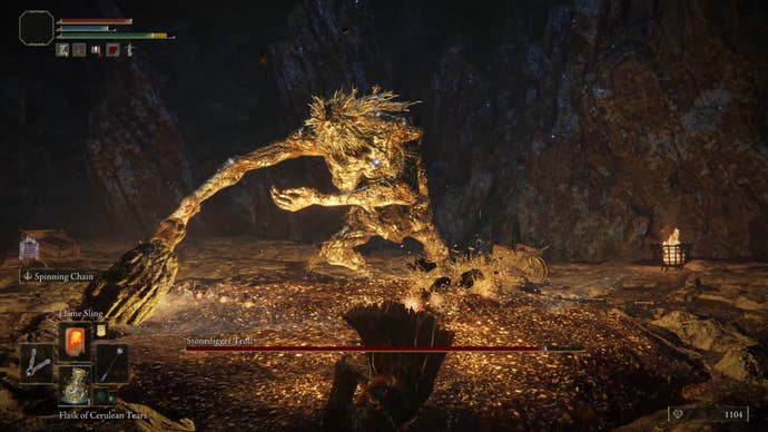 The Stonedigger Troll, an early boss in Elden Ring, swings his massive club towards the player.