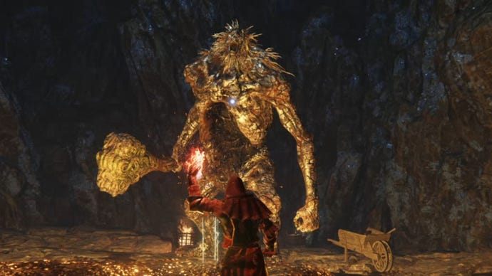 The Stonedigger Troll, an early boss in Elden Ring, faces down a player readying a flame spell to use against him.