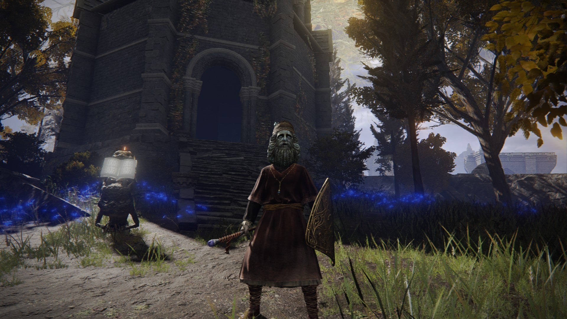 Elden Ring player standing in front of the Testu&rsquo;s Rise tower in the sun