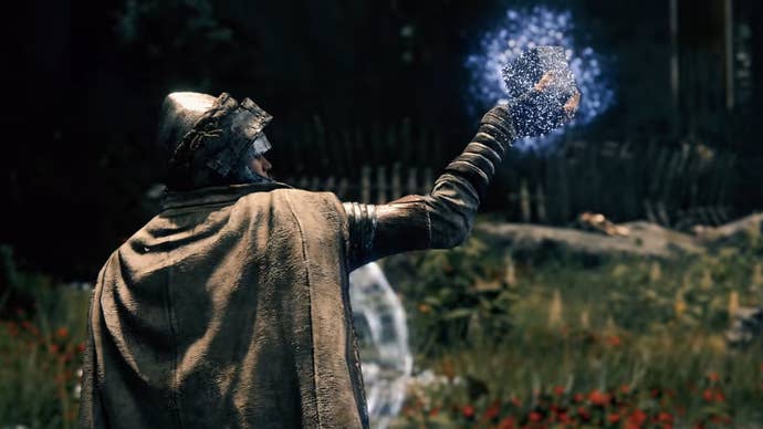 Elden Ring - A quality holds a cube aloft successful the aerial with a bluish magical aura astir it.