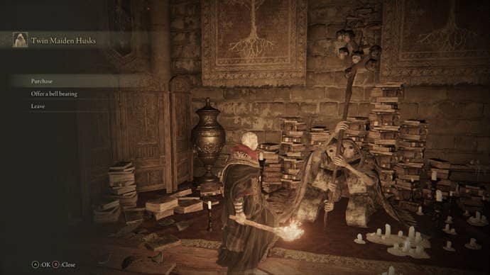 Elden Ring player standing with the twin maiden husks, surrounded by scattered piles of books