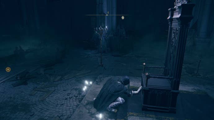 The player in Elden Ring: Shadow Of The Erdtree crouches down and places their hand on the base of Count Ymir’s empty throne.