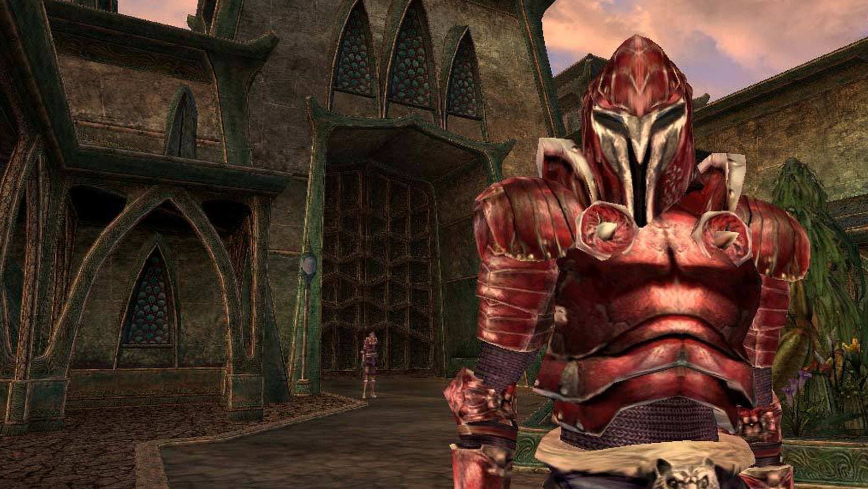 A guard in red armour is stood looking at the player in some kind of courtyard in a Morrowind screenshot. - 1