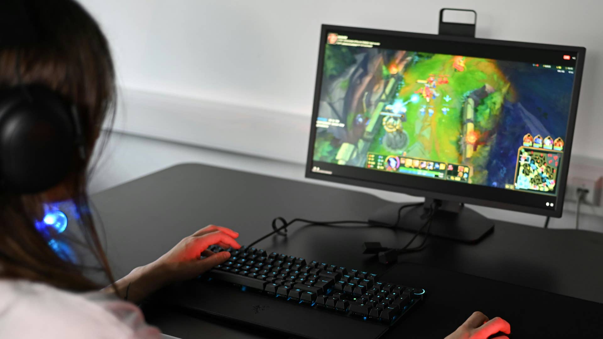 A girl playing a PC game