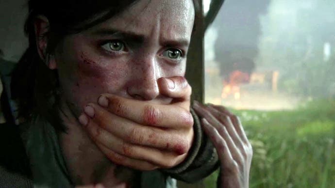 An unknown figure puts their hand of Ellie's mouth to keep her quiet in The Last of Us Part 2
