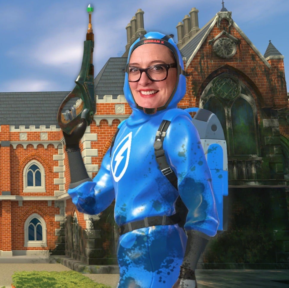 The PowerWash Simulator character, in blue overalls, in front of a filthy old school. Ellie Gibson&rsquo;s face has been cut out and placed on top of the character&rsquo;s face.