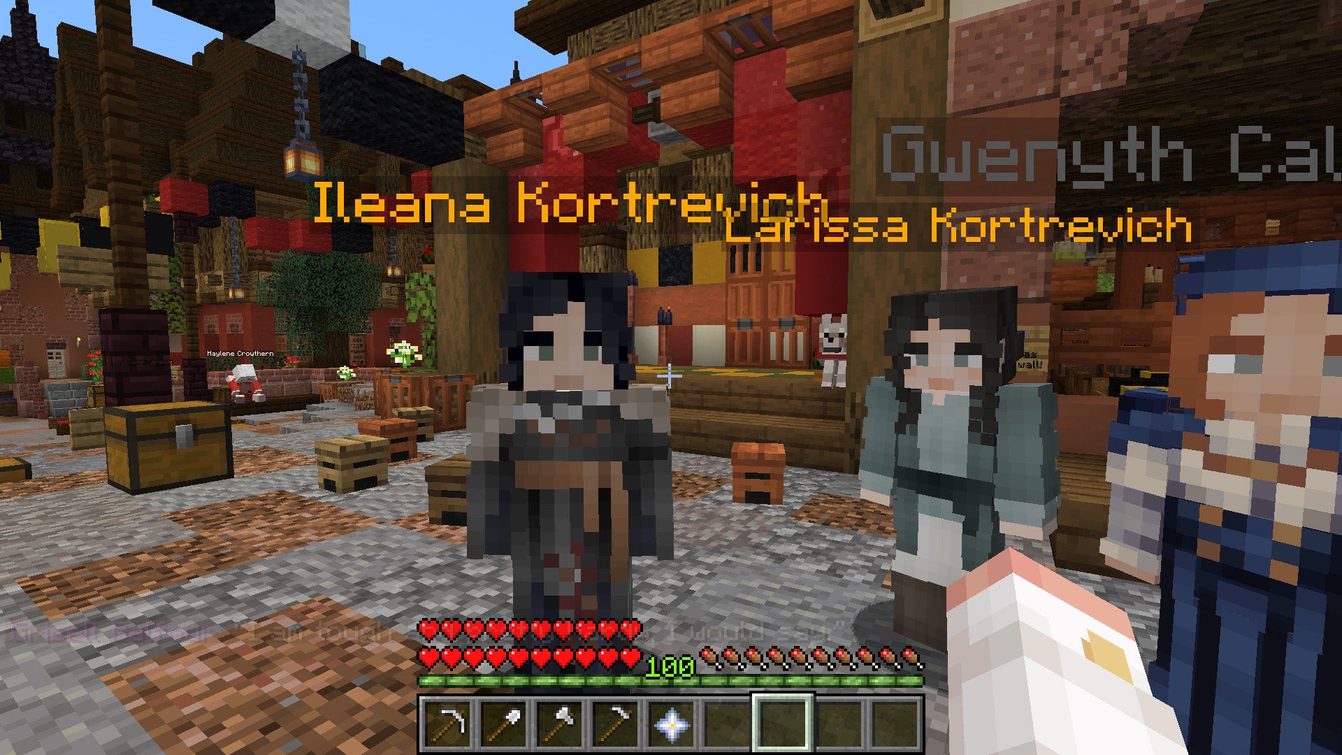 Minecraft characters - players - gather around Emma in a stony town square.