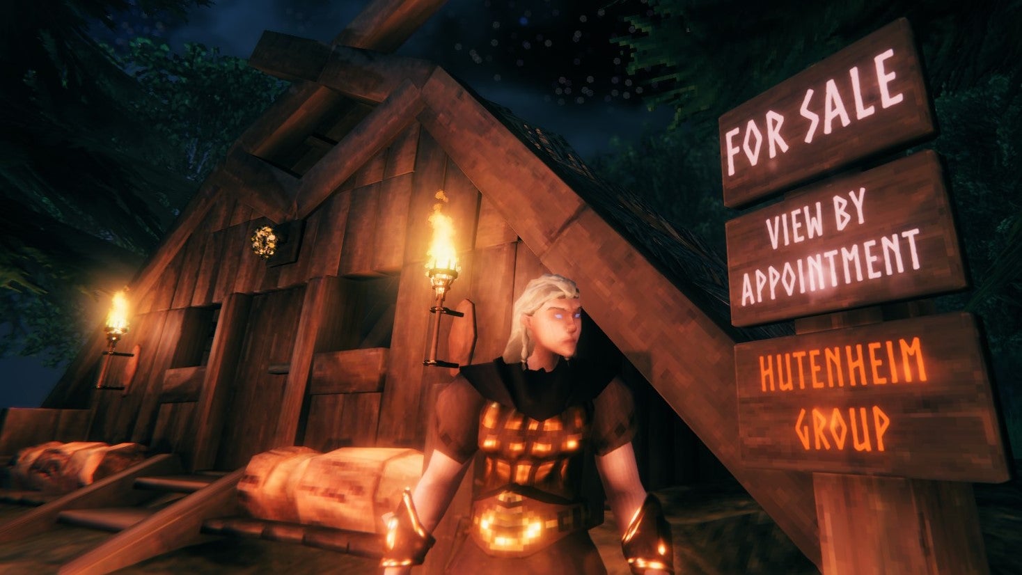A Viking woman stands in front of wooden hut and a sign, reading &ldquo;for sale, view by appointment, Hutenheim Group&rdquo;.