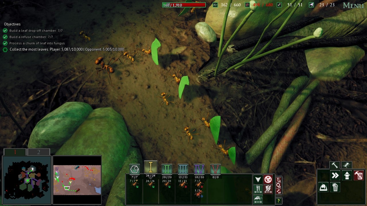 Ants carrying leaves across a dirt floor. - 1