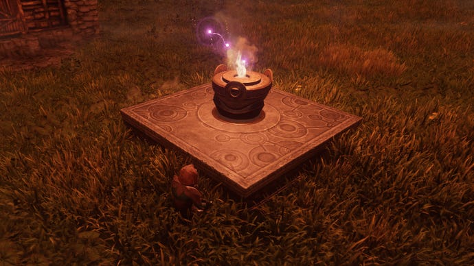The player in Enshrouded sits down beside their Flame Altar in the grass.