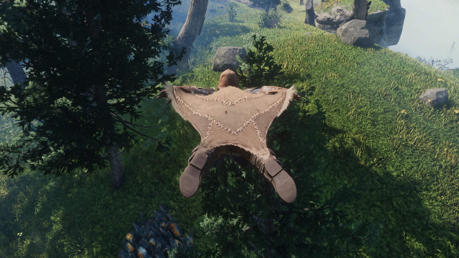 The player in Enshrouded uses the Glider to soar over the landscape. - 6