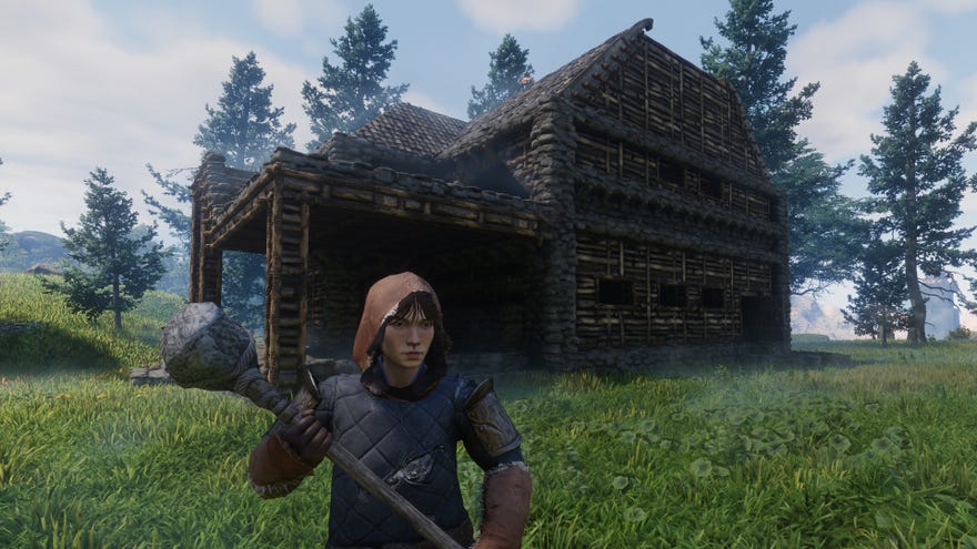 The player in Enshrouded stands outside their home, wielding a pickaxe.