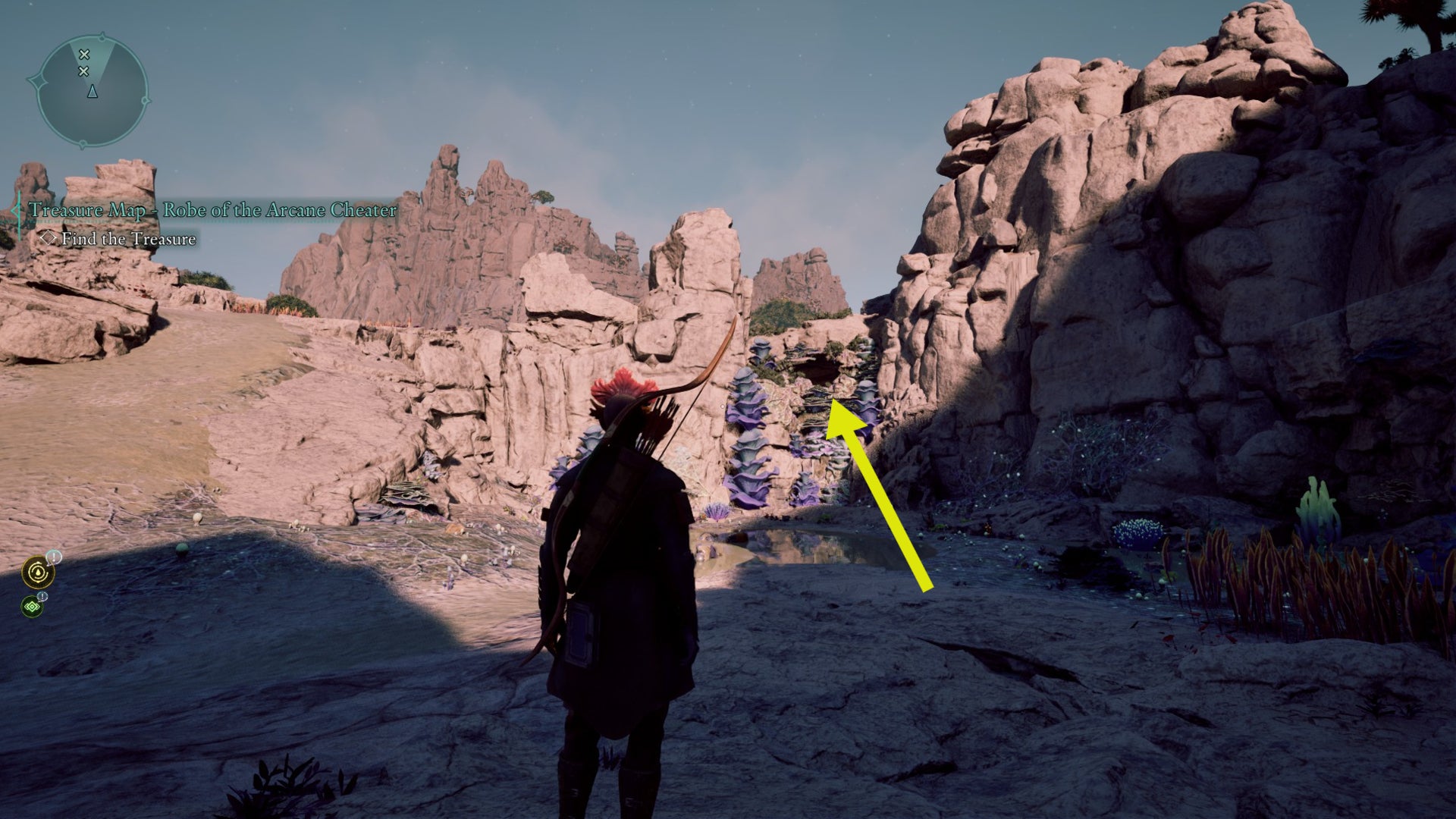 A yellow arrow in a dried lakebed points out a small opening that the Envoy must jump into in order to find the Robes of Surpassing Brilliance in Avowed. - 24