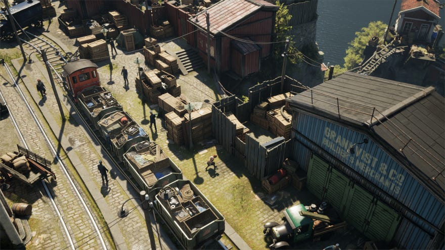 Crouching between some buildings and a train as seen from above in stealth game Eriksholm.