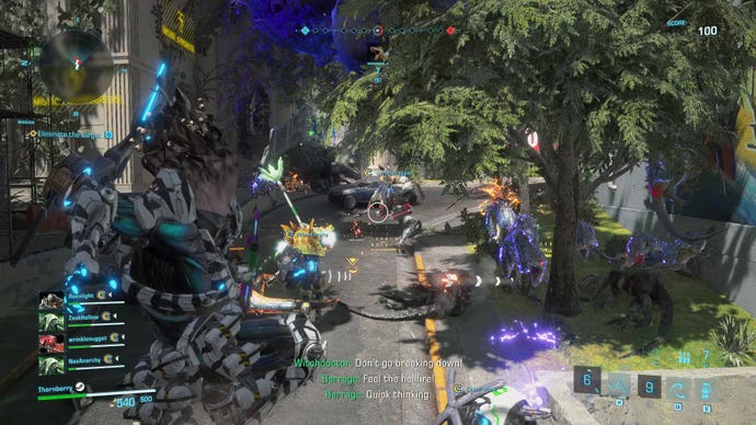 A grenadier exosuit leaps into the air and prepares to rain down fire in Exoprimal.