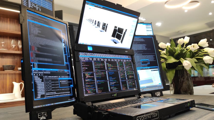 A photo of Expanscape's Aurora 7 laptop with seven screens folded out