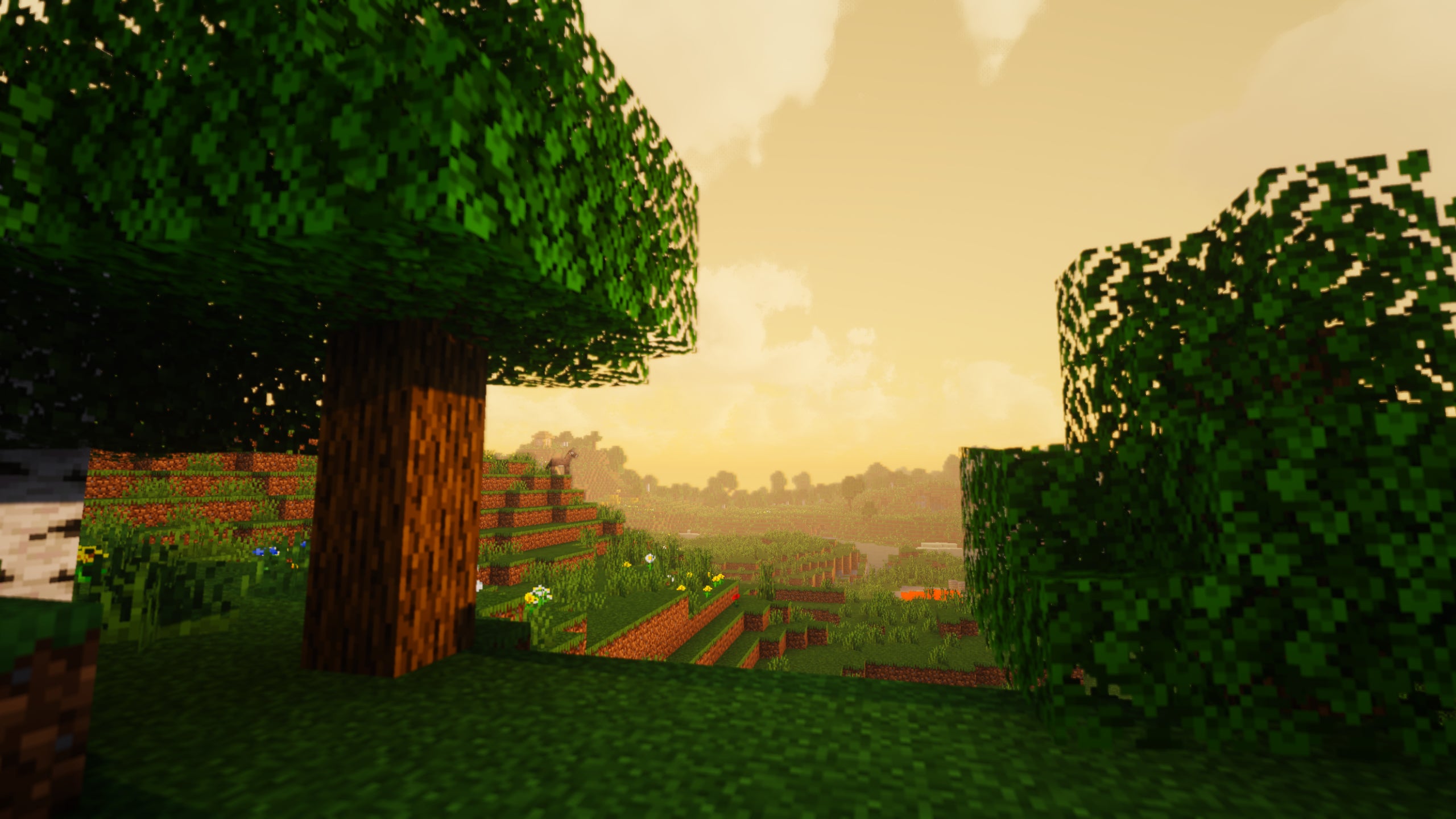 Two trees in a Minecraft landscape showcasing Exposa Shaders.