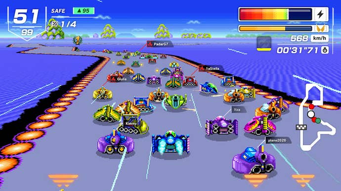 Screenshot of F-Zero 99 showing multiple vehicles racing along curving road