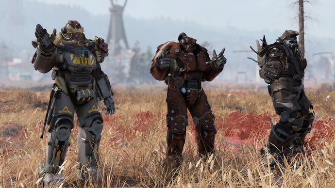 Three players are lined up in power armour in Fallout 76.