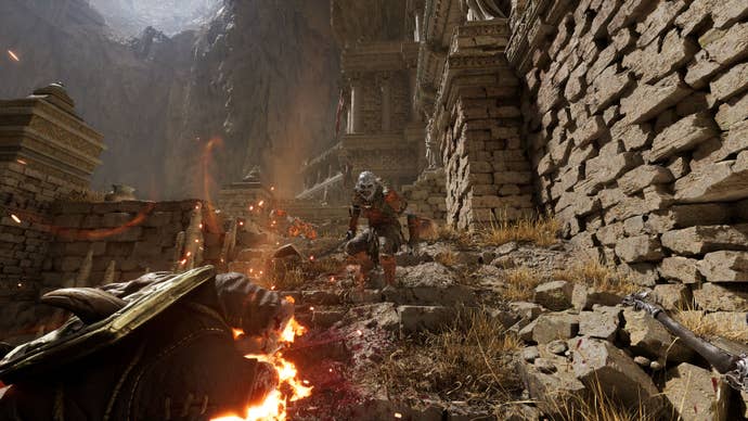 An enemy goblin dude approaches the player down some steep steps.