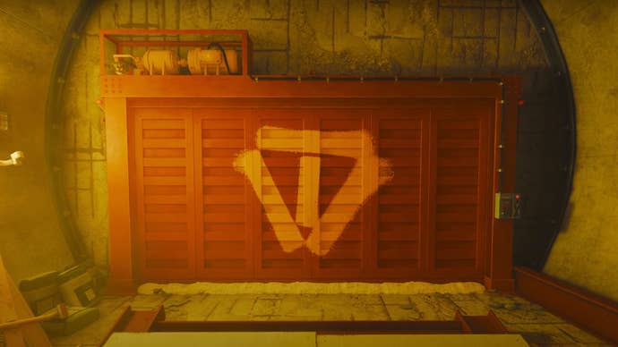 FBC: Firebreak screenshot showing an imposing red safety door deep underground in the Oldest House.